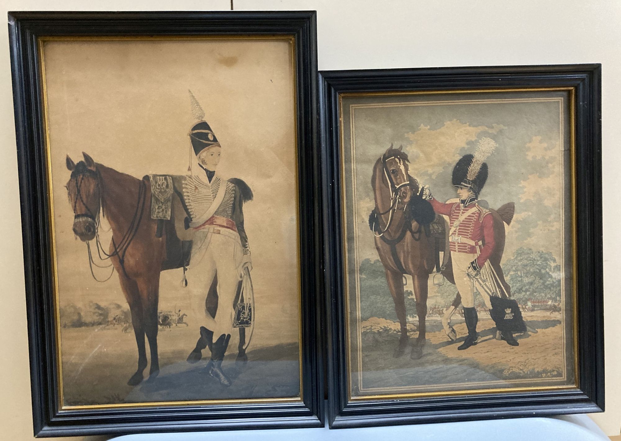 English School c.1800, watercolour, Portrait of a Hussar standing beside his horse, with George III cypher on the saddle, 41 x 27cm and